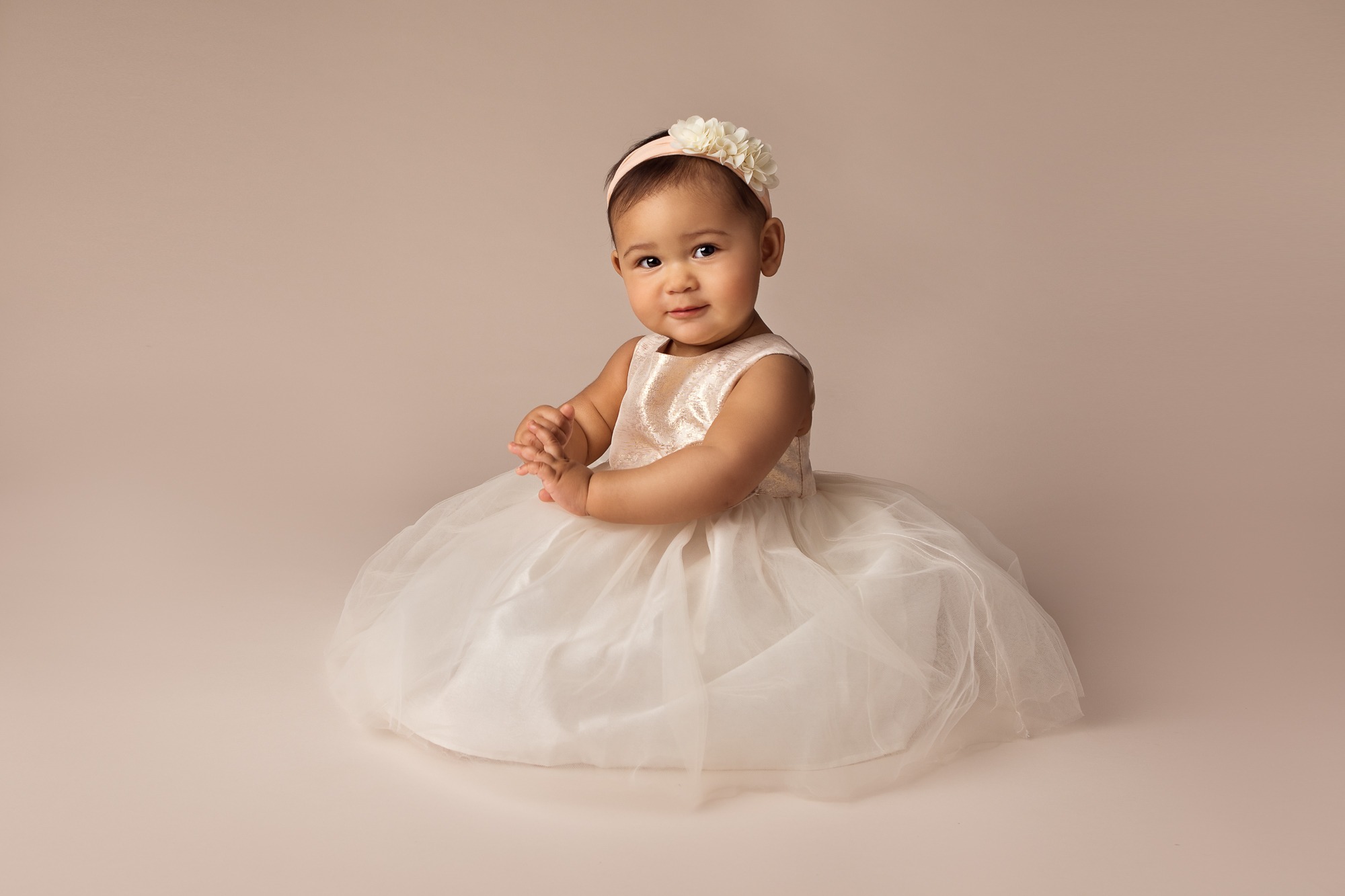 One-year-old girl in a timeless studio milestone portrait