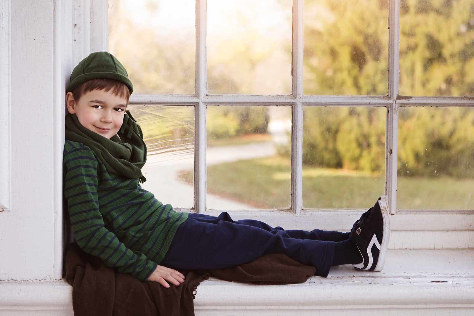 Child posing on the Mansion's Window