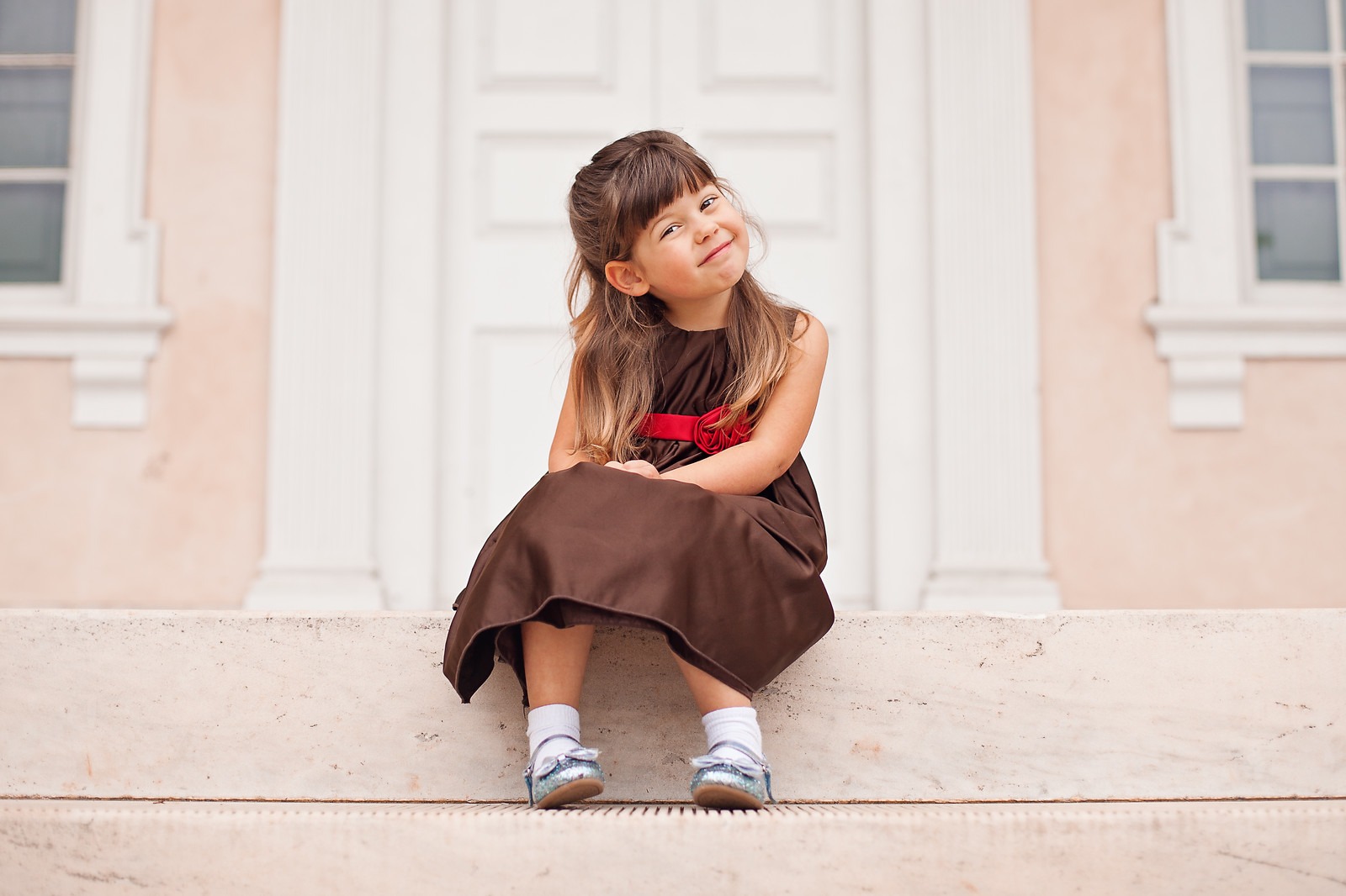 Girl Sitting on the Stairs of the Mansion