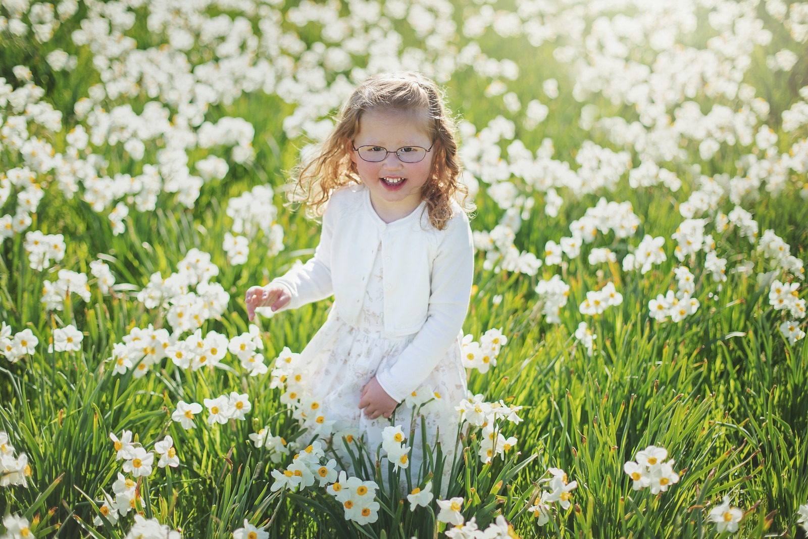 Girl Walking Through Daffodils in Cylburn Arboretum