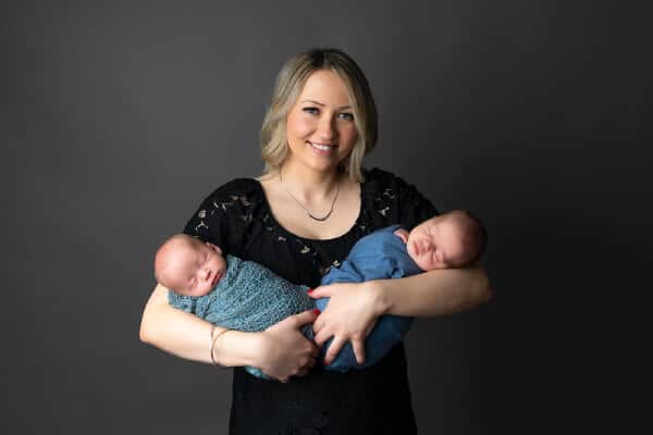 Mom holding twin newborns – Baltimore newborn photo session