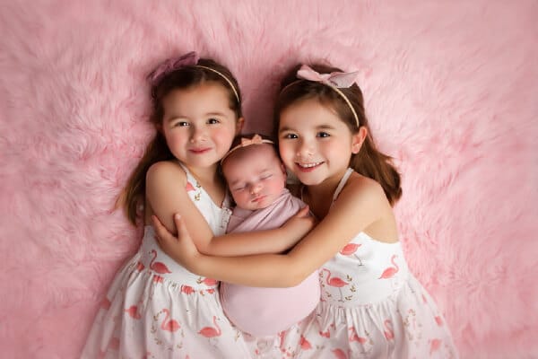 Newborn and big sisters photo