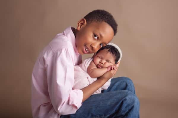 Newborn and sibling photo session in studio