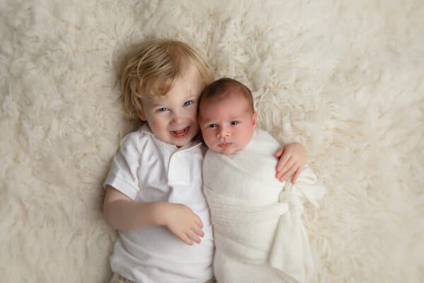 Preparing older child for newborn sibling photo session