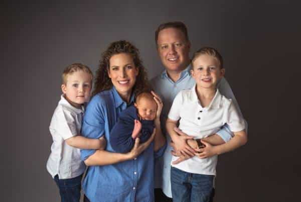 Federal Hill parents holding their newborn during studio portrait session