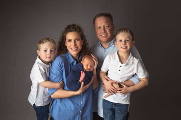 Mount Washington parents holding their newborn during studio portrait session