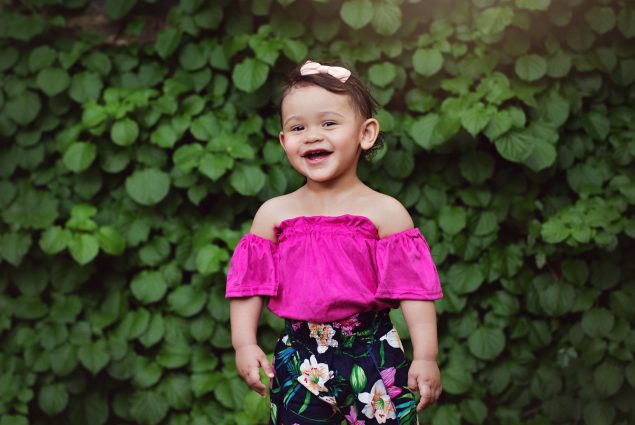 Girl in pink smiling
