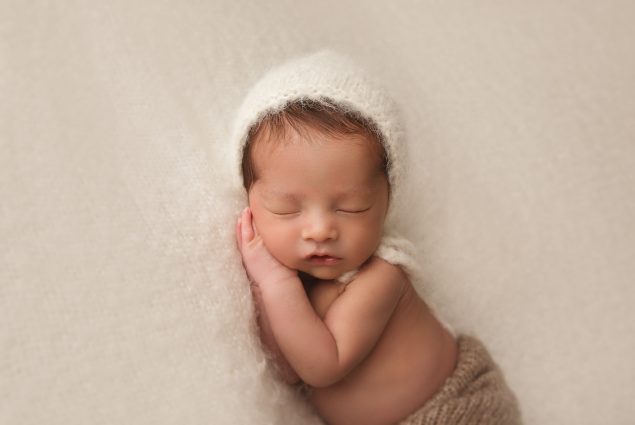Cream newborn setup in photography studio