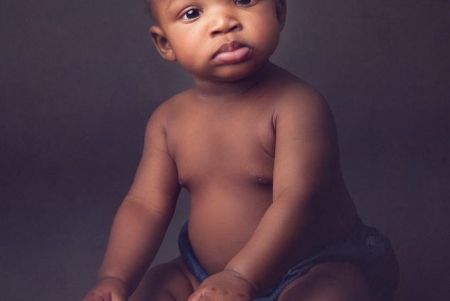 Curious baby girl in studio photography session