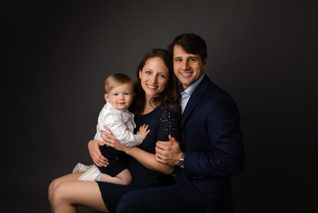 In studio family photo portrait mom dad son