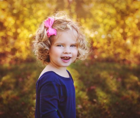 Outdoor fall portrait photoshoot of a child