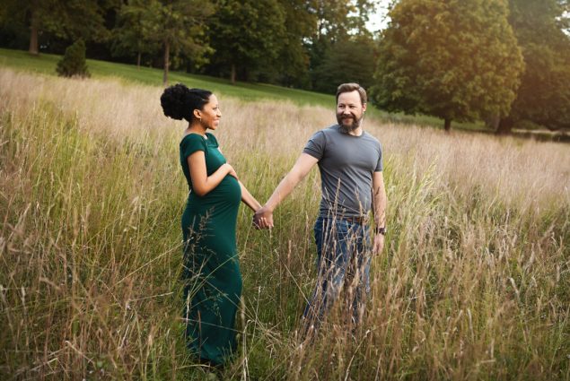 pregnancy portrait in nature husband wife.jpg