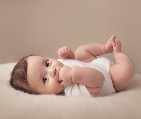 Professional picture of a cute baby boy in white