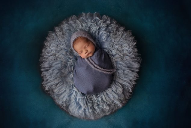 Professional studio setup in blue for newborn session
