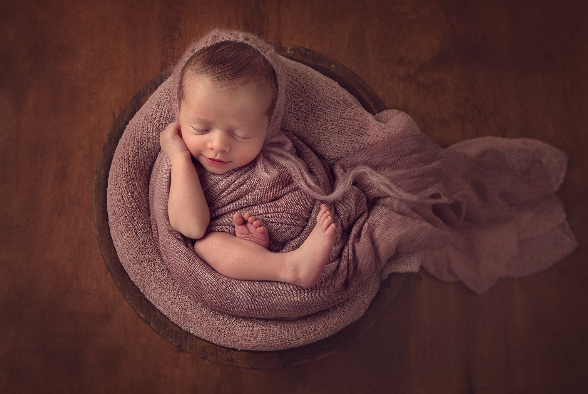Photo of a newborn girl smiling