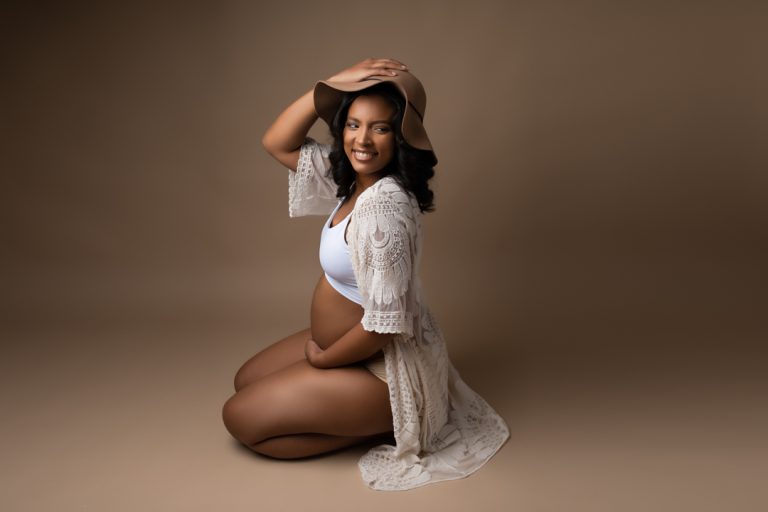 Professional maternity portrait, pregnant belly, studio