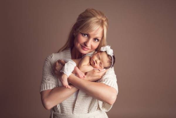 Columbia MD mom holding their newborn during studio portrait session