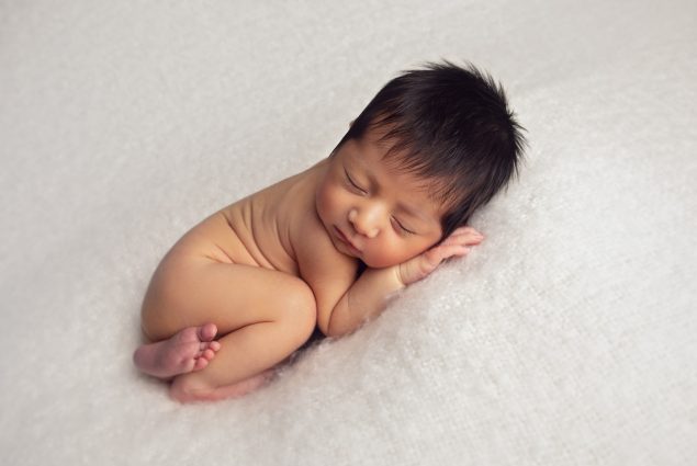 Newborn sleeping during a studio photo session