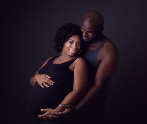 A couple in maternity session in studio