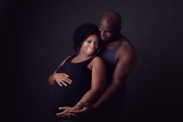 A couple in maternity session in studio