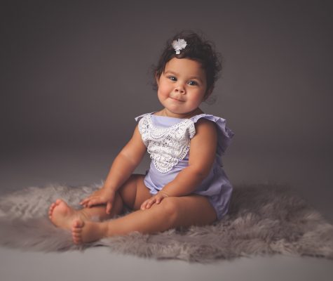 Cute baby girl posing for a milestone photo