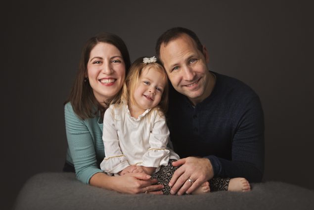Family of three in studio photography session