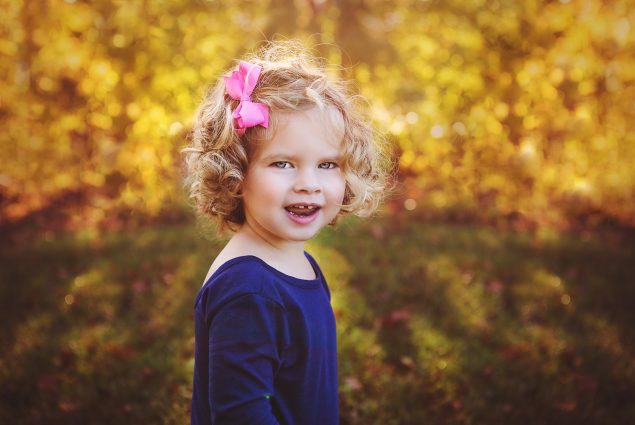 Outdoor fall portrait photoshoot of a child