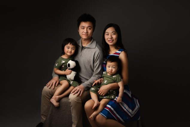 Parents with kids photo shoot in photography studio