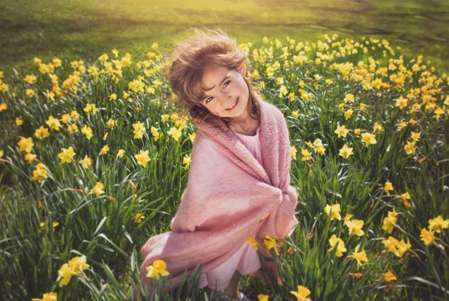 Picture of a girl in pink in daffodil field