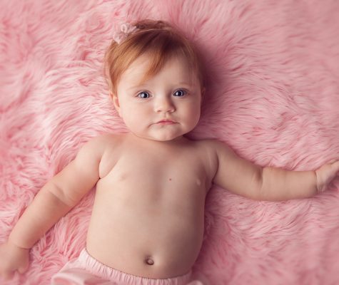Pink setup with baby girl in milestone session